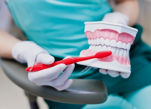 Dental Hygienist Cleaning Teeth