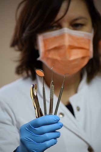 Dentist Holding Forceps