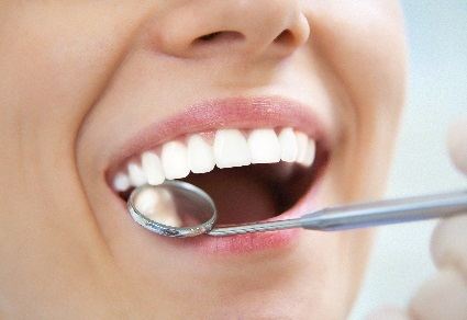 Periodontal disease can be treated or prevented by visiting the Madison family dentists at Total Care Dental. dental check-up preventing periodontis